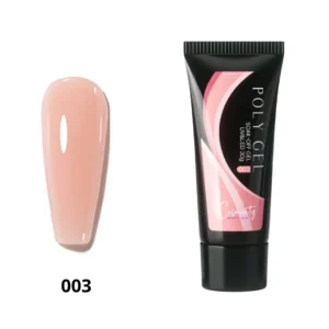 Tube de Polygel professionnel Cosminty beige nude posé à côté d'un pinceau spatule et d'une lampe LED, matériel d'onglerie à La Réunion.