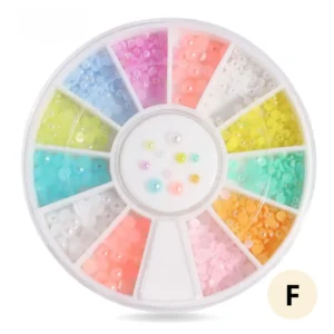 Roue de strass colorés pour ongles, 12 compartiments de cristaux brillants pour manucure créative.