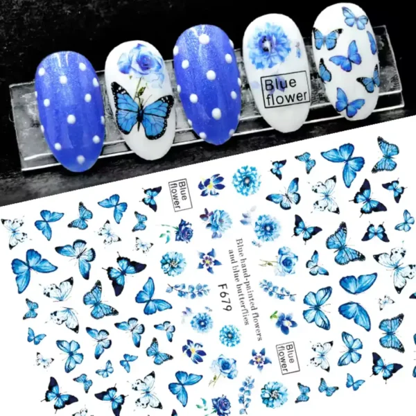 F679_resultat Planche de stickers Nail Art aux motifs de papillons monarques et de roses aquarelles dans des tons bleus référence F679, présentée à côté de capsules d'ongles affichant un Nail Art à pois et des décors floraux azur, Cosminty La Réunion.